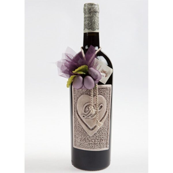 Etichetta in ceramica a rilievo patinata